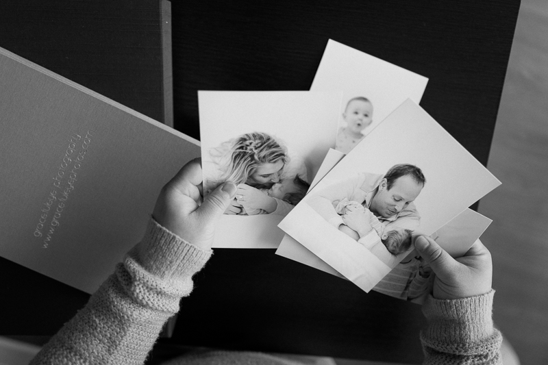 hands sifting through printed photographs