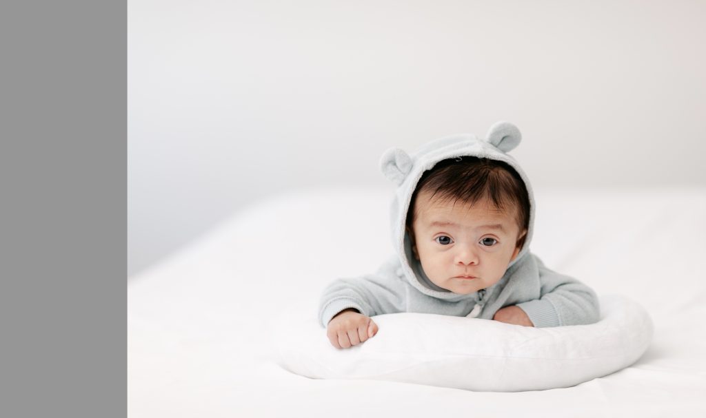 portrait of baby with minimalist lighting